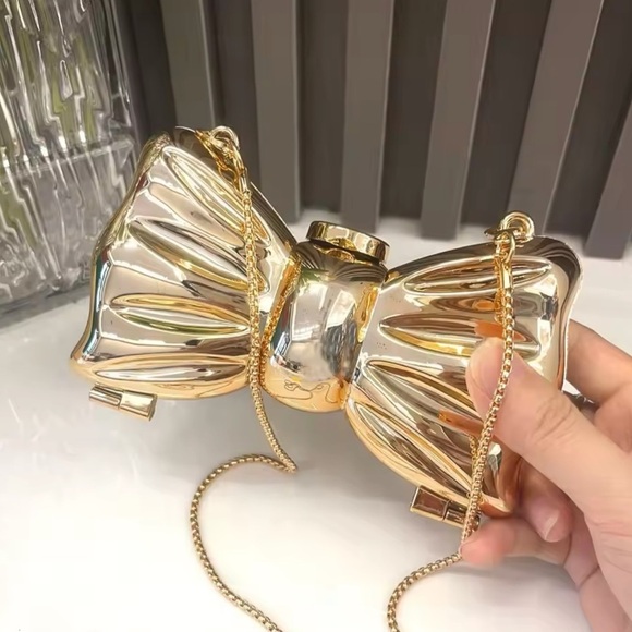 Anthropologie Handbags - Bow Gold Luxury Clutch